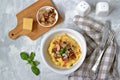 Homemade shrimp and grits with bacon, Chedder cheese and parsley in a white bowl. American cuisine