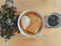 Homemade simple noodle served on wooden plate.