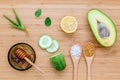Homemade skin care and body scrub with natural ingredients avocado ,aloe vera ,lemon,cucumber and honey set up on wooden