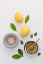 Homemade skincare concept, bath salt, lemon, honey dipper and mi