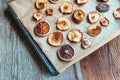 Homemade slices of dried apples and oranges on a baking tray. Top down view Royalty Free Stock Photo
