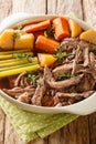 Homemade Slow Cooker Pot Roast with Carrots, Celery and Potatoes closeup on the wooden table. Vertical Royalty Free Stock Photo