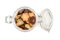 Homemade small cookies in a glass jar on white background