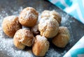 Homemade small donuts with powdered sugar