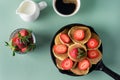 Homemade Small Pancakes with Strawberry Served in Frying Pan Green Background Fresh Pancakes and Cup of Coffee Tasty Breakfast Top Royalty Free Stock Photo