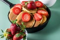 Homemade Small Pancakes with Strawberry Served in Pan Green Background Fresh Pancakes Tasty Breakfast Horizontal Royalty Free Stock Photo