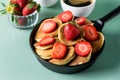 Homemade Small Pancakes with Strawberry Served in Pan Yellow Background Fresh Pancakes and Cup of Coffee Tasty Breakfast Above Royalty Free Stock Photo