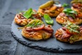 Homemade small pizza with pesto, salami, tomatoes and arugula Royalty Free Stock Photo