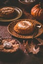 Homemade small pumpkin pies with icing for Thanksgiving