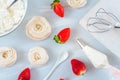 Homemade small strawberry pavlova meringue cakes pattern with cream top view Royalty Free Stock Photo