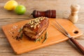 Homemade Smoked Barbecue Beef Brisket on wooden cutting board before cutting Royalty Free Stock Photo