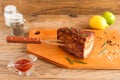 Homemade Smoked Barbecue Beef Brisket on wooden cutting board before cutting Royalty Free Stock Photo