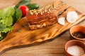 Homemade Smoked Barbecue Beef Brisket on wooden cutting board before cutting Royalty Free Stock Photo