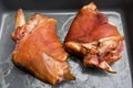 Homemade smoked ham hocks in a grey roasting pan Royalty Free Stock Photo