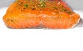 Homemade smoked and marinated salmon with dill on white dish. Royalty Free Stock Photo