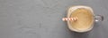 Homemade smoothie with coffee, oat and banana in a glass jar mug on a gray surface, top view. Overhead, from above. Copy space Royalty Free Stock Photo