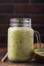 Homemade smoothie made from ripe kiwi fruits in a glass jar Royalty Free Stock Photo