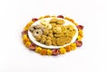 Homemade snacks with flowers kept with rangoli Royalty Free Stock Photo