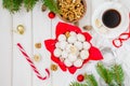 Homemade snowballs cookies with walnuts in icing sugar in a bowl on a white wooden background. Royalty Free Stock Photo