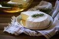 homemade soft cheese being wrapped in cheesecloth