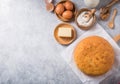 Homemade Soft and lite delicious sponge cake with ingredients: eggs flour milk on stone concrete table. Bakery background concept