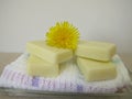Homemade solid body butter bars with dandelion flower oil Royalty Free Stock Photo