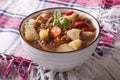 Homemade soup of brown lentils with chicken and vegetables.