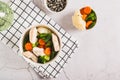 Homemade soup with chicken, cauliflower, broccoli, carrots and green beans in a bowl top view Royalty Free Stock Photo