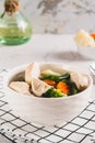 Homemade soup with chicken, cauliflower, broccoli, carrots and green beans in a bowl vertical view Royalty Free Stock Photo