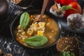 Homemade soup- dark photo. Background food- still life nosh. Serving meals in the home kitchen. Cook meals for the family