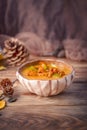 Autumn menu. Homemade soup with pumpkin and chanterelle mushrooms Royalty Free Stock Photo