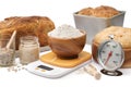 Homemade sourdough bread, natural leaven for bread in a glass jar, wooden bowl of dough, scale, a bowl of flour and thermometer