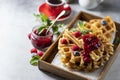 Homemade sourdough waffles with berry sauce for breakfast. The concept of proper nutrition