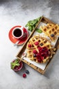 Homemade sourdough waffles with berry sauce for breakfast. The concept of proper nutrition