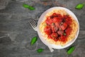 Homemade spaghetti and meatballs table scene on slate