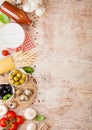 Homemade spaghetti pasta with quail eggs with bottle of tomato sauce and cheese on wooden background. Classic italian village food