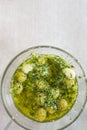 Homemade Spanish Style Pitted Green Olives Marinated in Oil with Garlic Herbs and Parsley. Top View. Mediterranean Cuisine Royalty Free Stock Photo