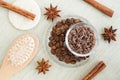 Homemade spicy aroma scrub with brown sugar, ground coffee, olive oil, cinnamon and star anise powder. Royalty Free Stock Photo