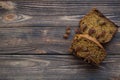 Homemade spicy carrot cake slices with anise star, raisins, walnuts, cinnamon on rustic wooden brown background, free copy space. Royalty Free Stock Photo