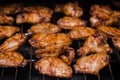 Homemade spicy marinated chicken wings and wing stick on barbecue BBQ grill ready for the family party night. buffalo chicken Royalty Free Stock Photo
