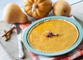 Homemade spicy pumpkin pie with cinnamon in silicone bakeware