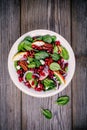 Homemade spinach, apple, pecan, red onion salad with goat cheese and pomegranate Royalty Free Stock Photo