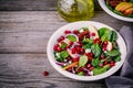 Homemade spinach, apple, pecan, red onion salad with goat cheese and pomegranate Royalty Free Stock Photo