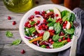 Homemade spinach, apple, pecan, red onion salad with goat cheese and pomegranate Royalty Free Stock Photo