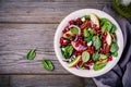 Homemade spinach, apple, pecan, red onion salad with goat cheese and pomegranate Royalty Free Stock Photo