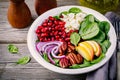 Homemade spinach, apple, pecan, red onion salad with goat cheese and pomegranate Royalty Free Stock Photo