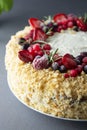 Homemade sponge cake with cream and fresh berries. Carrot and orange cake, decorated with berry. Close up sweet dessert. Whole Royalty Free Stock Photo
