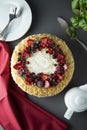 Homemade sponge cake with cream and fresh berries. Carrot and orange cake, decorated with berry. sweet dessert. Whole deliciouse