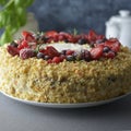 Homemade sponge cake with cream and fresh berries. Carrot and orange cake, decorated with berry. sweet dessert. Whole deliciouse Royalty Free Stock Photo