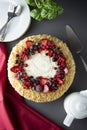 Homemade sponge cake with cream and fresh berries. Carrot and orange cake, decorated with berry. sweet dessert. Whole deliciouse